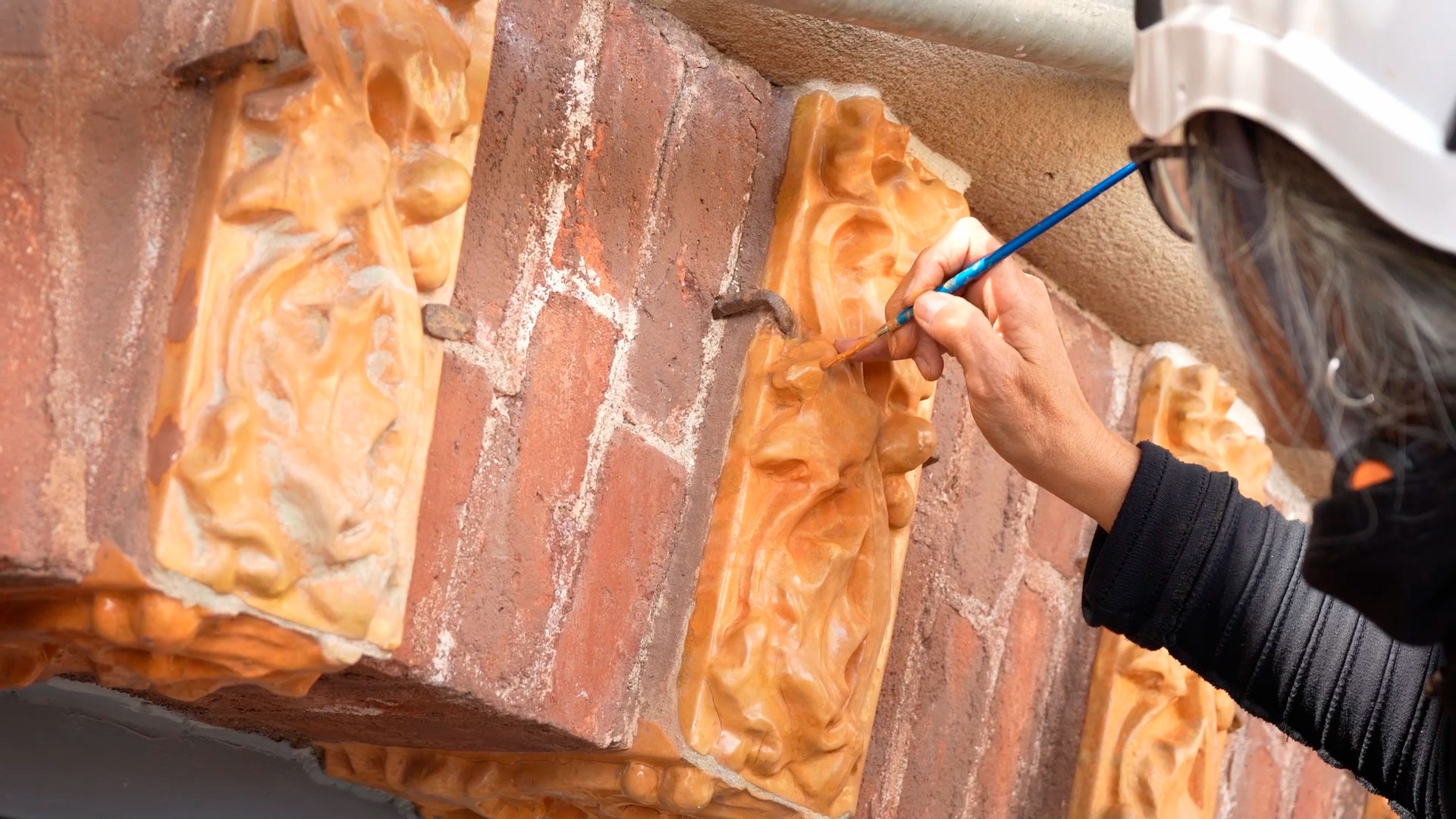 Craftsperson working on the restoration of unique elements